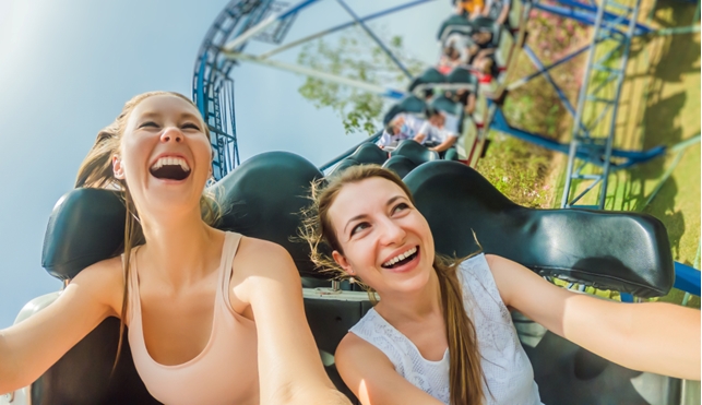 Couple of friends on a rollercoaster